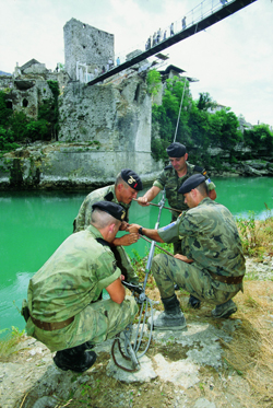 Paratroops making the footbridge taut at the Old Bridge in Mostar.