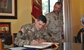 The US general signs the Visitors’ Book