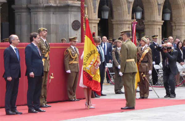 The Queen hands over the flag to the commander of the unit