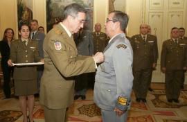 The Chief of the Army (JEME) gives a medal to one of the soldiers
