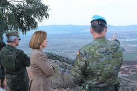 The Minister gazes at the surrounding areas of the base