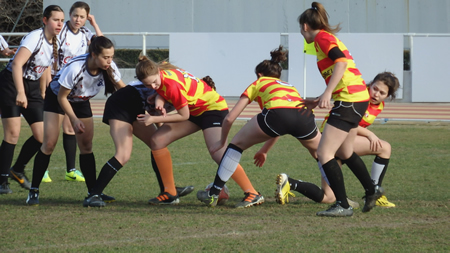 The female rugby team in a match in the Dean Trophy