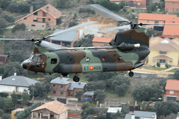 Chinook Helicopter Flying Over a Town in the Madrid Mountains